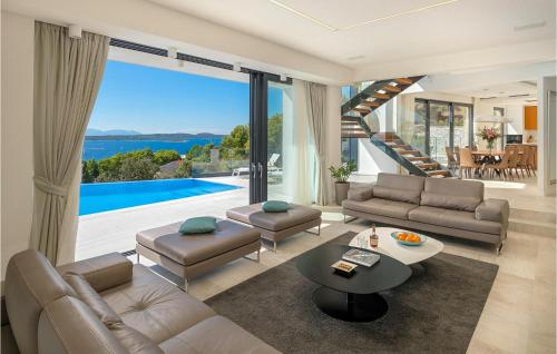 a living room with a couch and a table at Villa Afrodita in Hvar