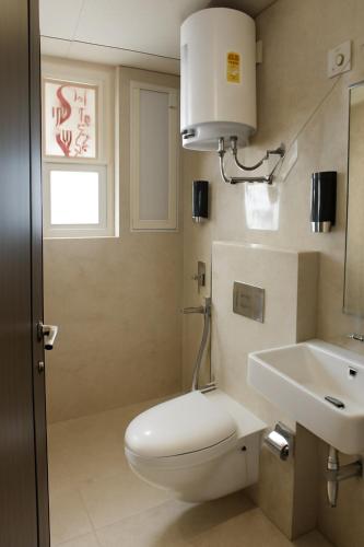 a bathroom with a toilet and a sink at Sukoon Forever in Ghaggar