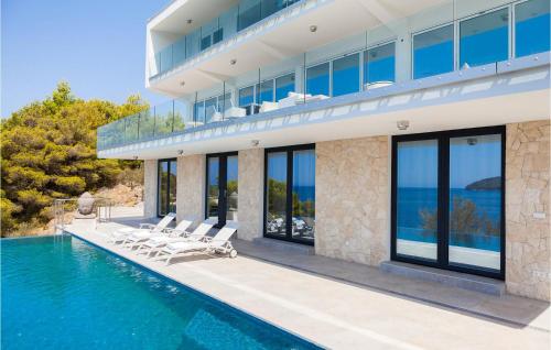 an exterior view of a house with a swimming pool at Villa Style And Sea in Korčula