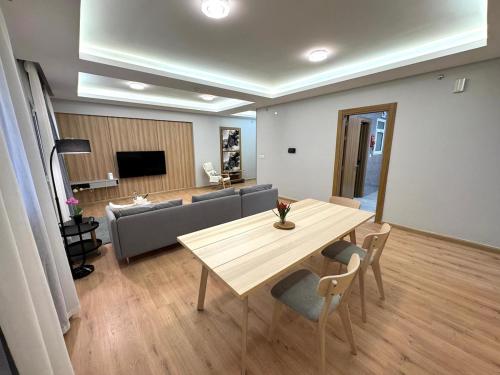 a living room with a table and a couch at Mabaat-Superior 2BR- Sama Jeddah 609 in Jeddah