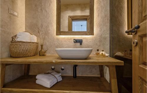 a bathroom with a sink and a mirror at Gorgeous Home In Cera With Wifi 