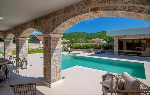an external view of a swimming pool in a villa at Gorgeous Home In Cera With Wifi 