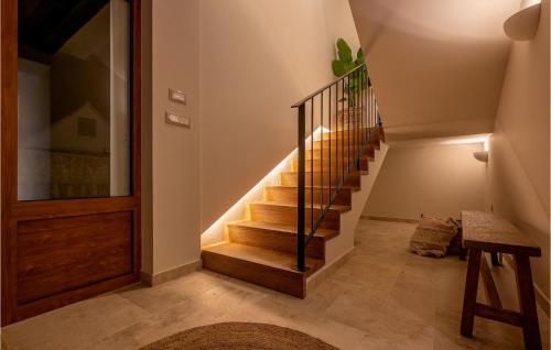 a staircase in a house with a wooden door at Gorgeous Home In Cera With Wifi 
