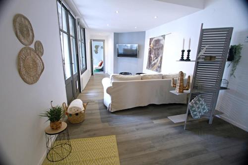 a living room with a couch and a table at Apartment with Exceptional View in Périgueux