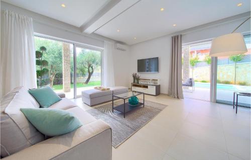 a living room with a couch and a table at Villa Valentino in Kornić