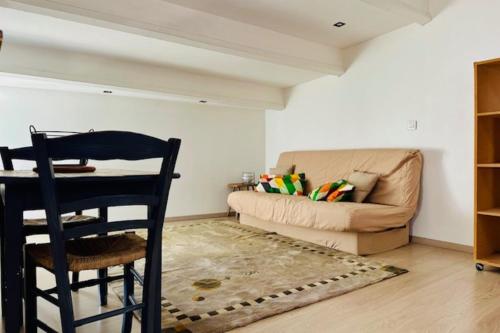 a living room with a chair and a couch at Studio for two of 25 m2 in Saint-Xandre in Saint-Xandre