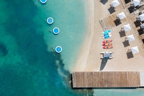 an overhead view of a beach with boats and a dock at Hammock Cove Antigua - All Inclusive - Adults Only in Willikies
