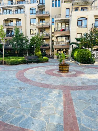 a courtyard in front of a large apartment building at Sorrento E 4 4 Sveti Vlas in Sveti Vlas