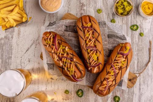 two hot dogs on a table with french fries at Moon Palace The Grand Cancun All Inclusive in Cancún