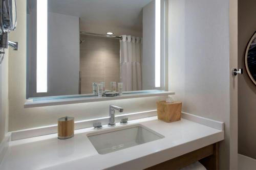 a bathroom with a sink and a mirror at Newport Marriott Hotel & Spa in Newport