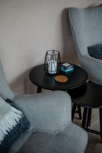 a living room with two chairs and a table at Maddis in Kirkjubæjarklaustur