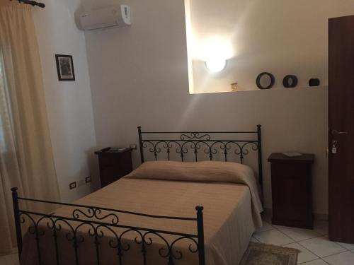 Postel nebo postele na pokoji v ubytování Sciacca Bed and Breakfast Natoli