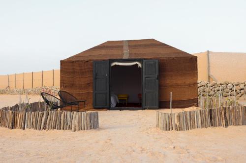 a small building in the middle of the desert at Desert Sands Dakhla Lagoon View & Kitesurf Spot in Dakhla