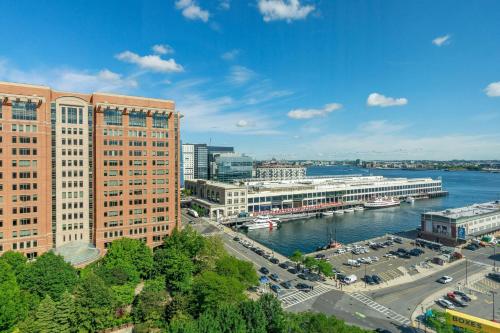 a view of a city with a river and buildings at Renaissance Boston Seaport District in Boston