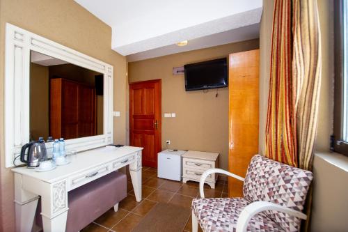 TV a/nebo společenská místnost v ubytování New Hotel Kuč By Marvel