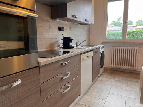 a kitchen with a sink and a counter top at Villa Relax&Fly near Malpensa with Pool in Sumirago