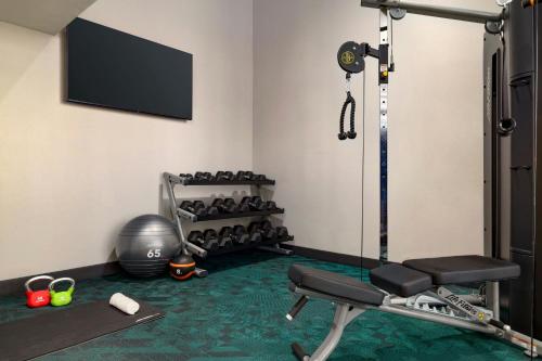 a room with a gym with a treadmill at TownePlace Suites by Marriott Williston in Williston
