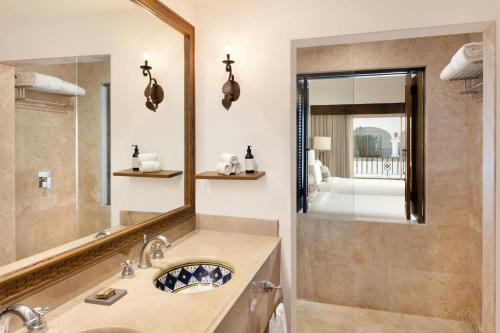 a bathroom with a sink and a mirror at Hacienda del Mar Los Cabos, an Autograph Collection All-Inclusive Resort in Cabo San Lucas