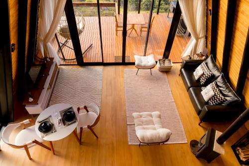 an overhead view of a living room with chairs and tables at Cabana Silfra in Gonçalves