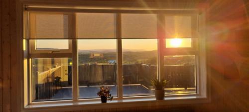 a window in a room with a view of a balcony at Luxury Family Getaway in Selfoss