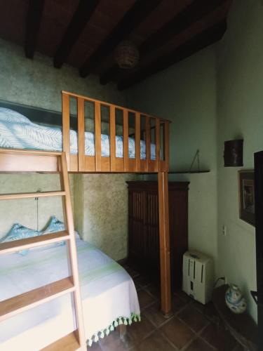 a bedroom with two bunk beds in a room at Botanical Studios Sayulita in Sayulita