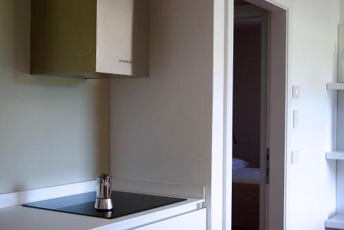 a kitchen with a sink and a cupboard at APPARTAMENTO I SENTIERI 29D in Dro
