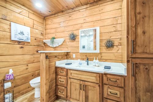 a bathroom with a sink and a toilet at Great Smoky Mountain, Hot Tub, Mins to Dollywood in Kodak