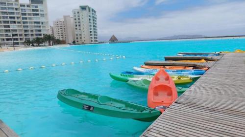 a group of kayaks in a swimming pool at Acogedor Apartamento en Laguna del Mar in La Serena