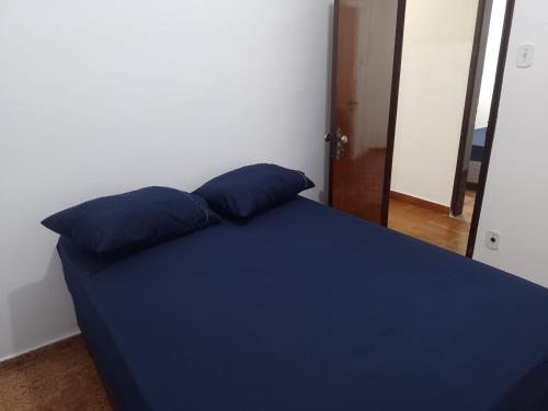 Ένα ή περισσότερα κρεβάτια σε δωμάτιο στο Casa Abençoada - Aparecida SP