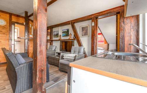 a kitchen and living room in a tiny house at Cozy Apartment In Smarje With House Sea View in Šmarje