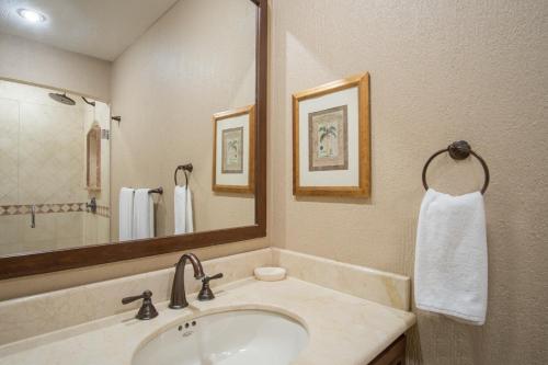 a bathroom with a sink and a mirror at Sonoran Sky in Puerto Peñasco