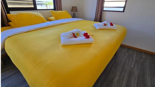 Postel nebo postele na pokoji v ubytování Tahiti Kalihi Lodge
