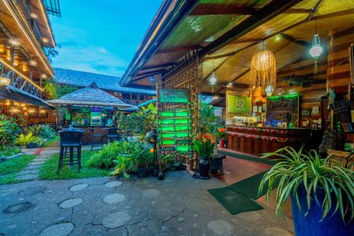 a store with plants in the front of a building at Puerto Pension Inn in Puerto Princesa City
