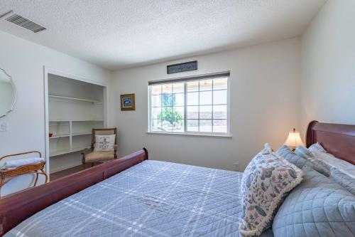 a bedroom with a large bed and a window at Oak Pass Ranch in Paso Robles