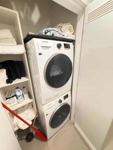 a washer and dryer in a small room at RED Mountain Suite in Rossland