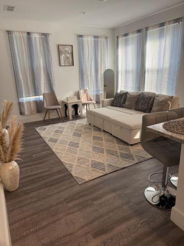 a living room with a couch and a table at Cozy Contemporary Condo in Atlanta