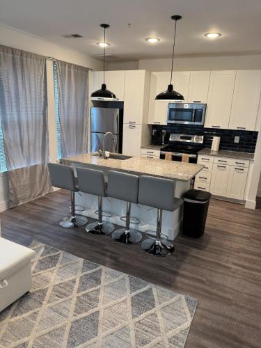 a kitchen with a sink and a counter top at Cozy Contemporary Condo in Atlanta