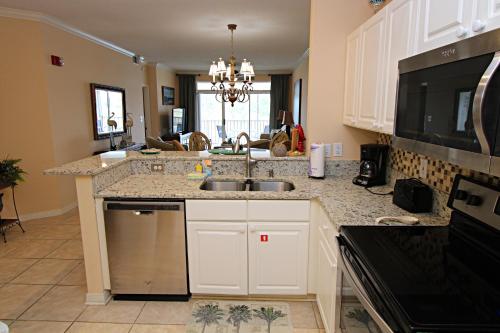 a kitchen with a sink and a counter top at Cypress Point in Gulf Shores