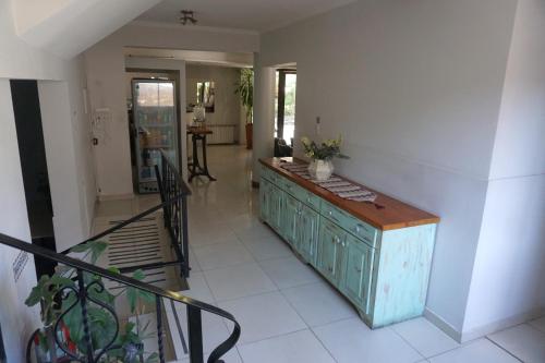 a kitchen with a wooden counter in a room at Hotel Sienna in Mendoza