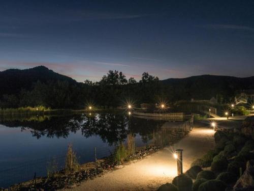 a view of a lake at night with lights at Holiday Home in Quillan near Pyrenees in Quillan