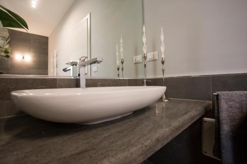 a white bowl sink on a counter in a bathroom at Casa Vacanze La Mattonara in Viterbo