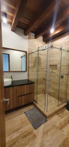 a bathroom with a shower and a sink at Awa C-103 in Playa del Carmen