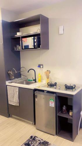 a small kitchen with a sink and a counter at Sure Stay Homes in Marimbeti