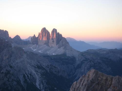 a view of a mountain range at sunset at Klaudehof in Dobbiaco