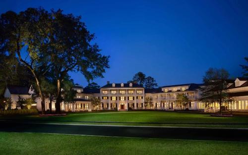 an exterior view of a large building at night at Signature 4 Bedroom Residence 1033 in Bluffton