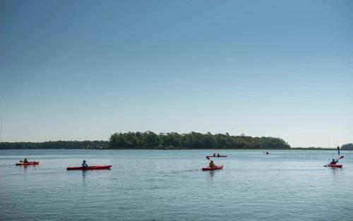 a group of people in kayaks on a lake at Signature 4 Bedroom Residence 1033 in Bluffton