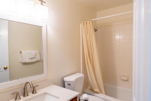 a bathroom with a sink and a shower at Road Creek Inn in Loa