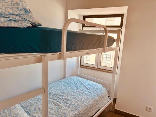 Ένα ή περισσότερα κρεβάτια σε δωμάτιο στο Guest House Vasco da Gama