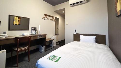 Katil atau katil-katil dalam bilik di Hotel Route-Inn Myoko Arai