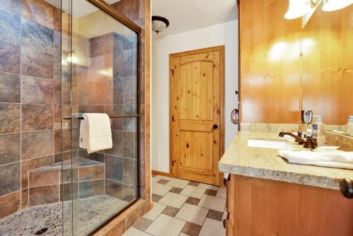a bathroom with a shower and a sink at Pleasant Pause#1864 in Fawnskin